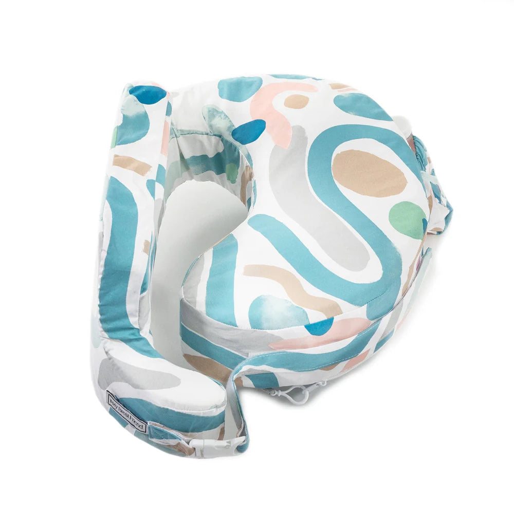 Baby carrier with colorful abstract pattern on a white background