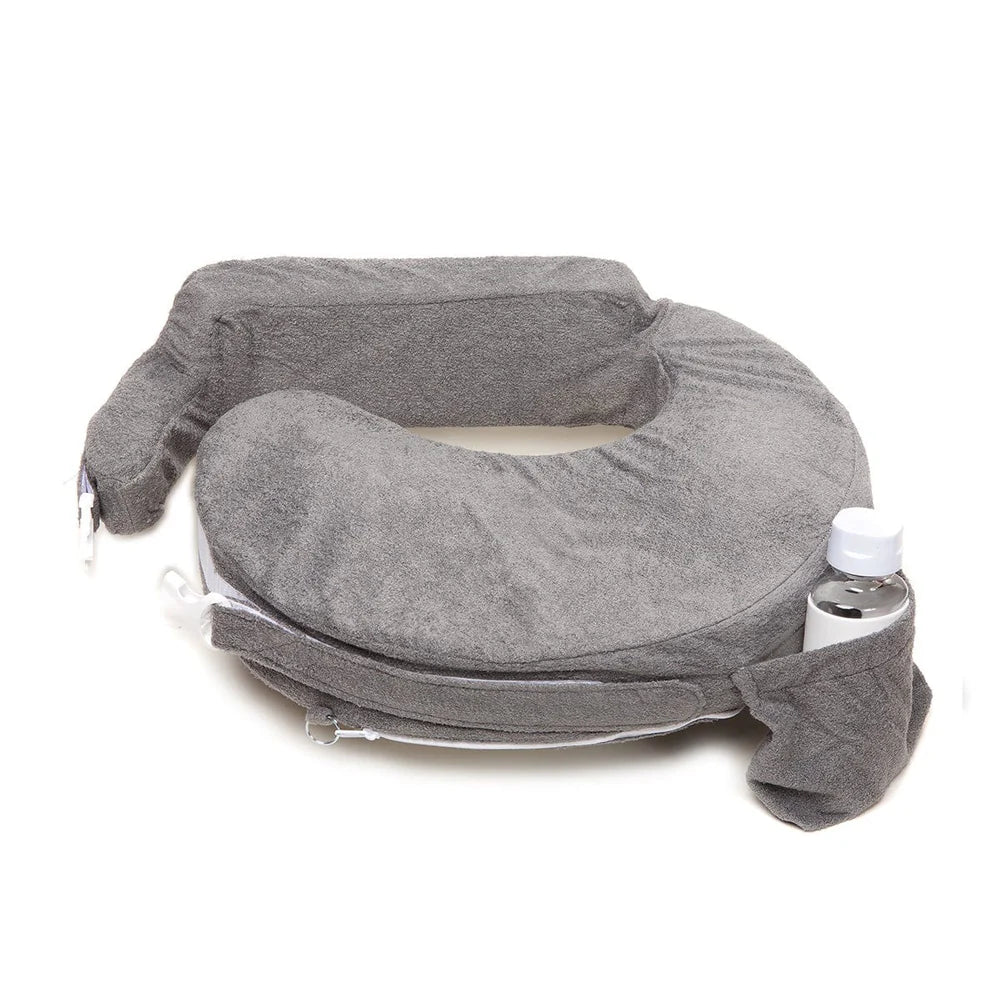 A gray, U-shaped breastfeeding pillow with a soft, plush texture. It features a side pocket holding a water bottle, highlighting practicality and comfort.