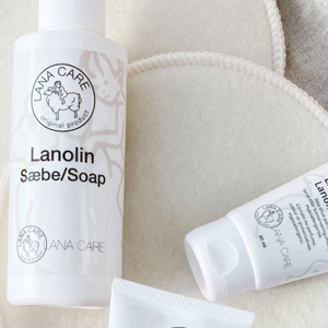 LANACare lanolin soap and cream on a textured surface