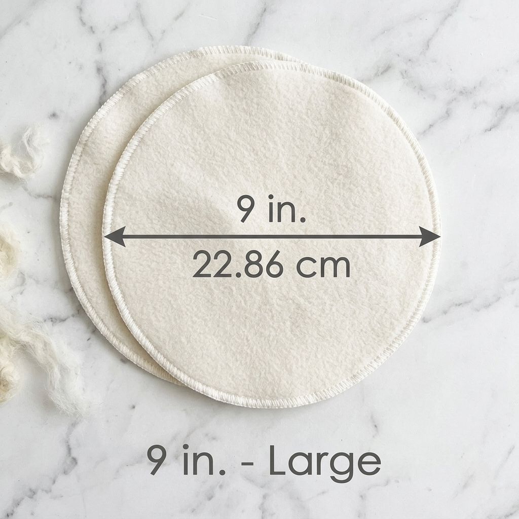Two round white pads with measurements on a marble background