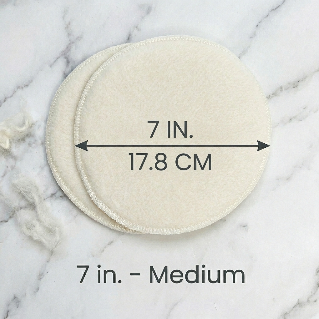 Two circular pads on a marble surface with measurements indicated.