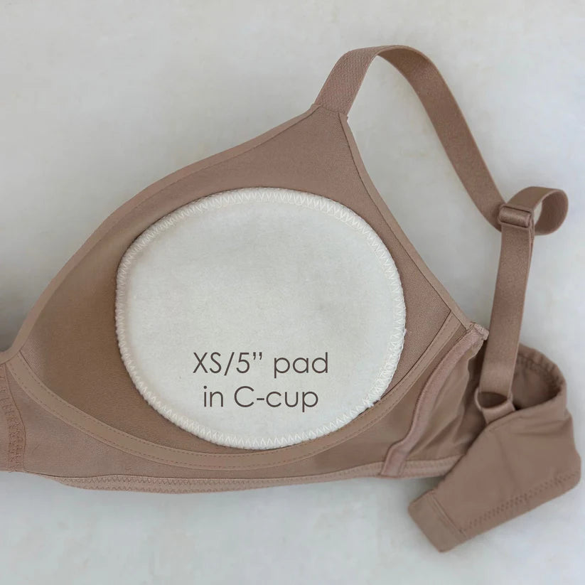 Brown bra with a white XS/5" pad labeled on a white background