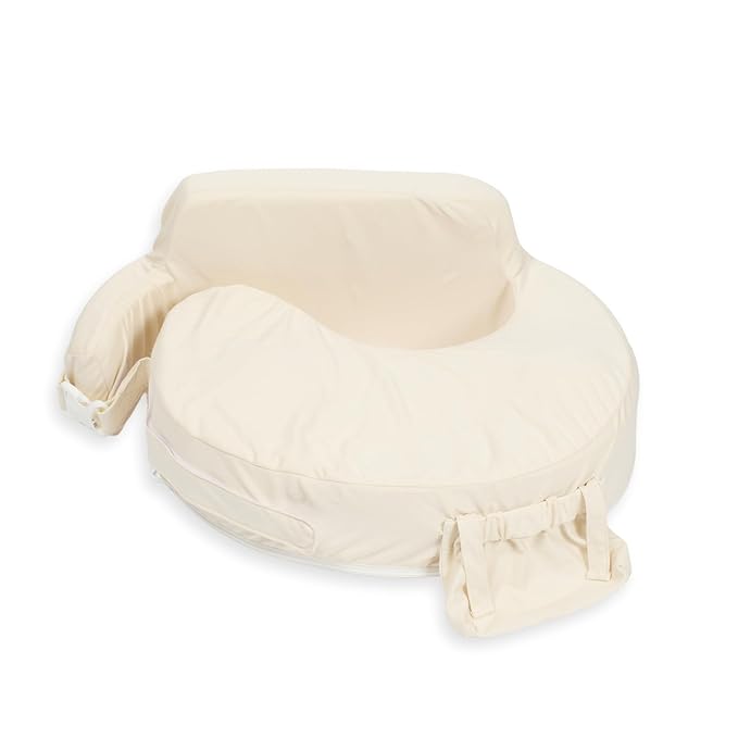 My Brest Friend nursing pillow in a solid cream cotton fabric, featuring a wrap-around cushion design, integrated back support cushion, and a front accessory pocket.