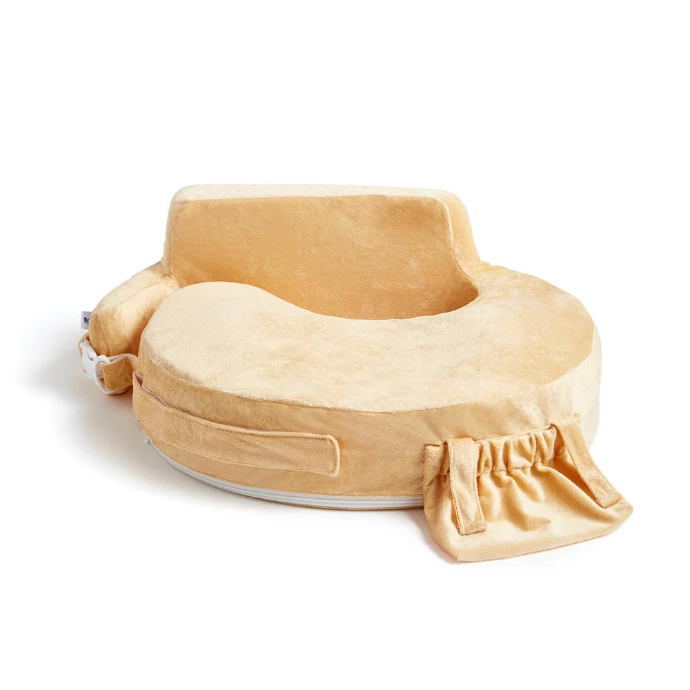My Brest Friend nursing pillow in a soft butter yellow plush fabric, featuring a wrap-around cushion design, integrated back support cushion, and a front accessory pocket.